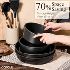 CAROTE pans stacked for storage with handles removed