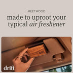 Drift wood air freshener clipped to a car air vent