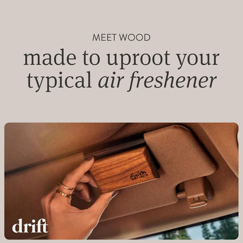 Drift wood air freshener clipped to a car air vent