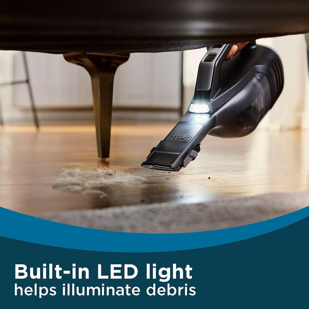 Dustbuster Reveal LED light illuminating debris under furniture