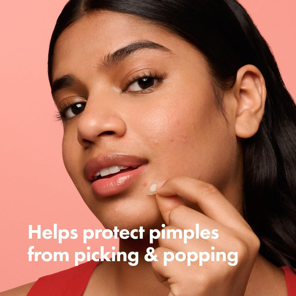 Woman applying a Mighty Patch to protect a pimple from picking