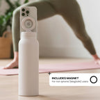 RINGO PRO bottle holding a phone on a yoga mat