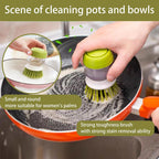 Soap-dispensing dish brush scrubbing a frying pan
